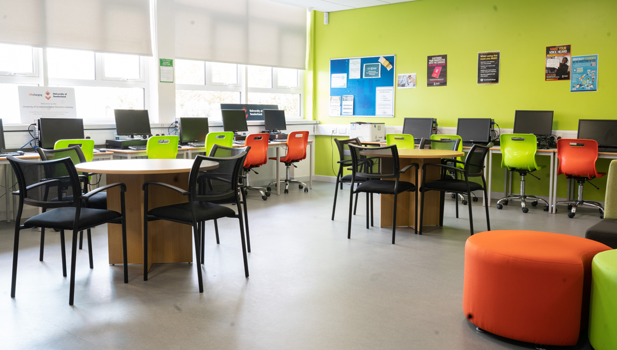 A classroom with tables and chairs