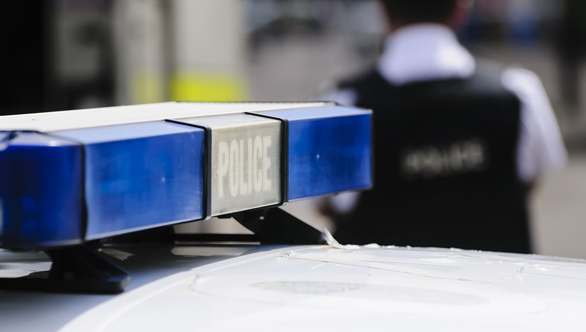 Blue lights on the roof of a police vehicle