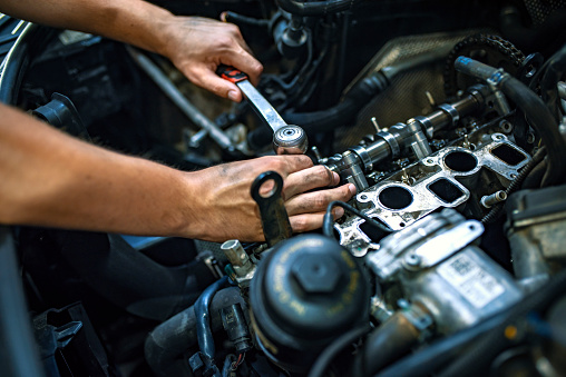 Mechanic working on a car engine