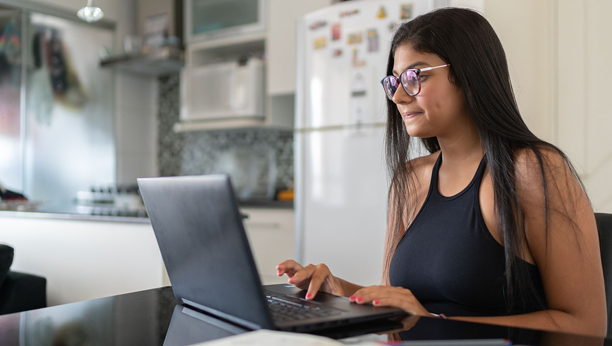 Young woman using laptop at home