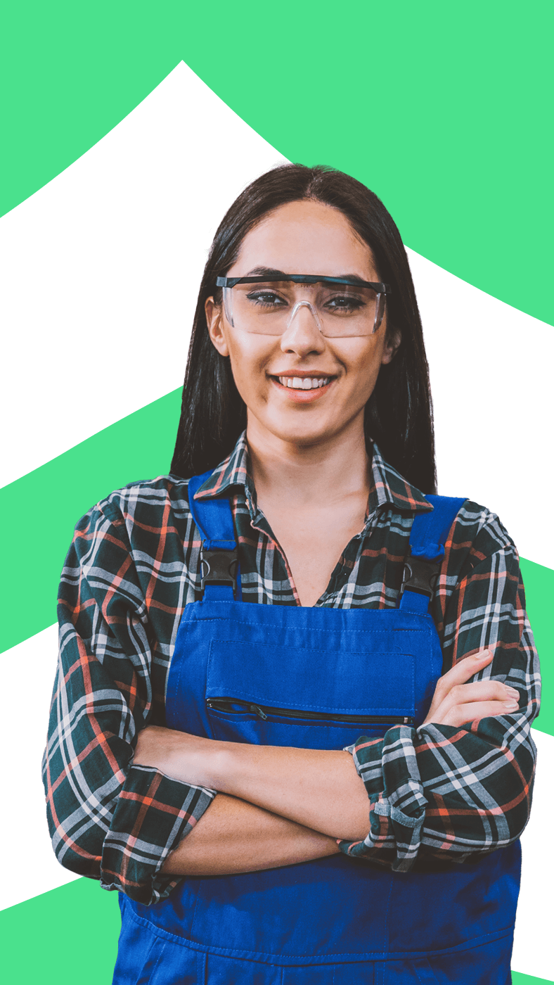 A woman in overalls with glasses and a green chevron background.